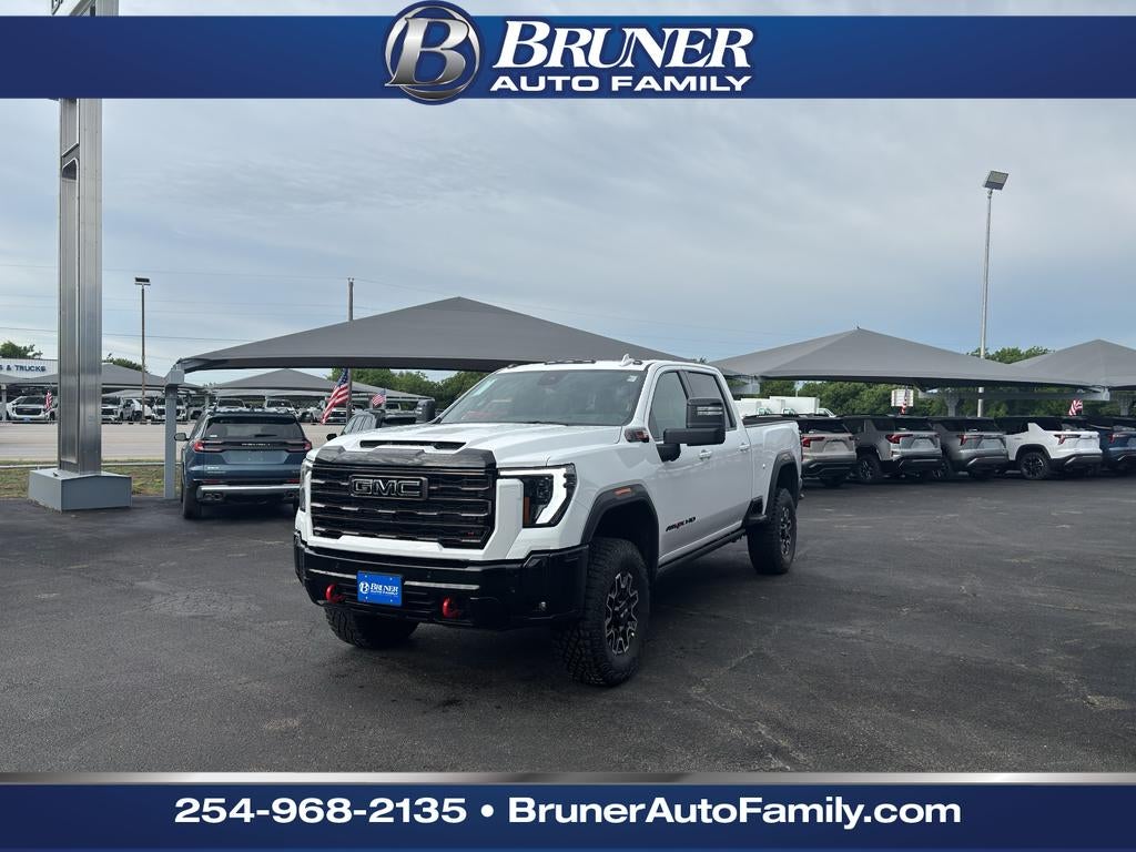 2026 GMC Sierra 2500 HD AT4X in Summit White — front three-quarter view