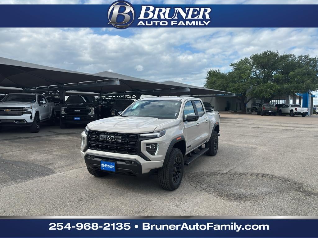 2026 GMC Canyon Elevation in Coastal Dune — front three-quarter view