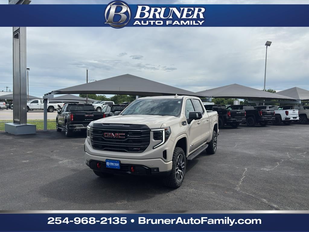 2026 GMC Sierra 1500 AT4 in Coastal Dune — front three-quarter view