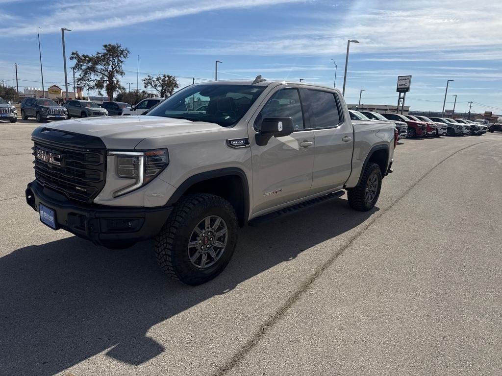 2026 GMC Sierra 1500 AT4X in Coastal Dune — front three-quarter view