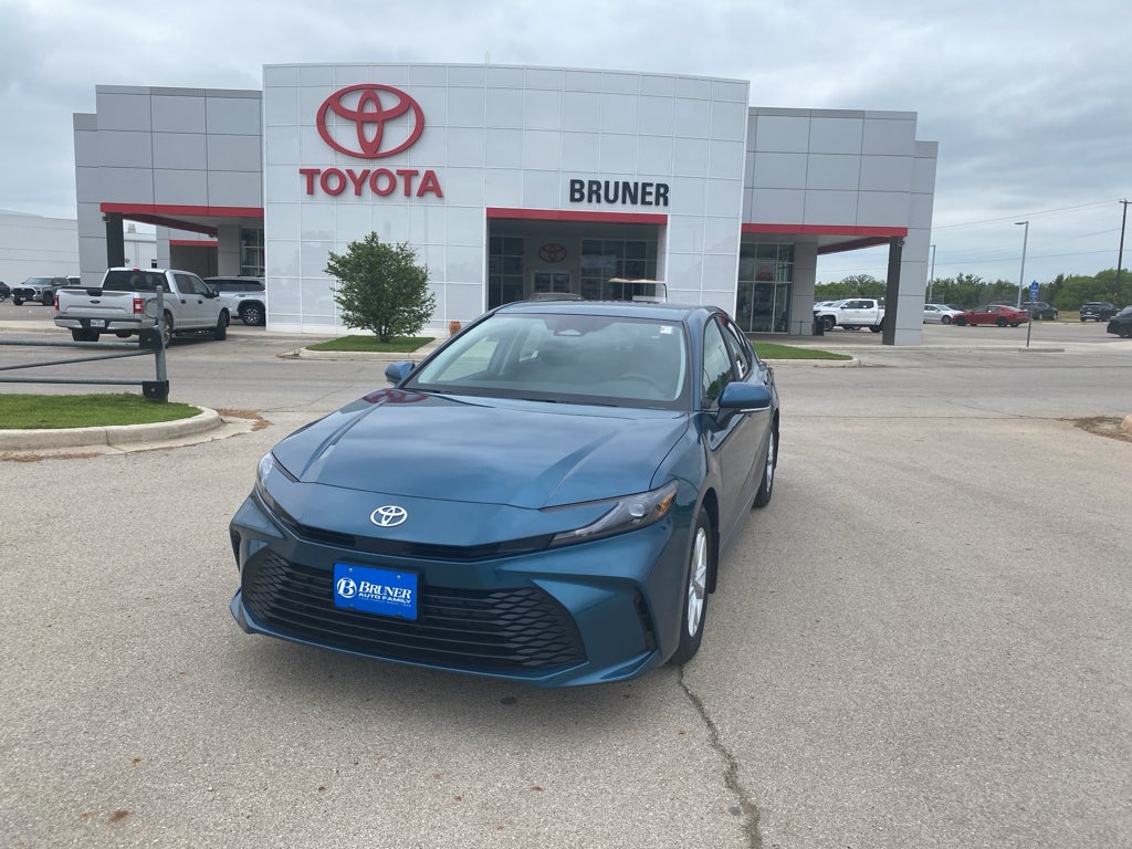 2026 Toyota Camry LE in Grn — front three-quarter view
